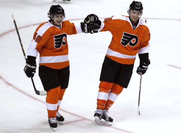 Flyers' Briere congratulates Giroux for his goal against the Canadiens during the second period of their NHL hockey game in Philadelphia